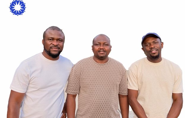 Three men from Communomics' team stood together facing the camera, with the Communomics logo in the corner.